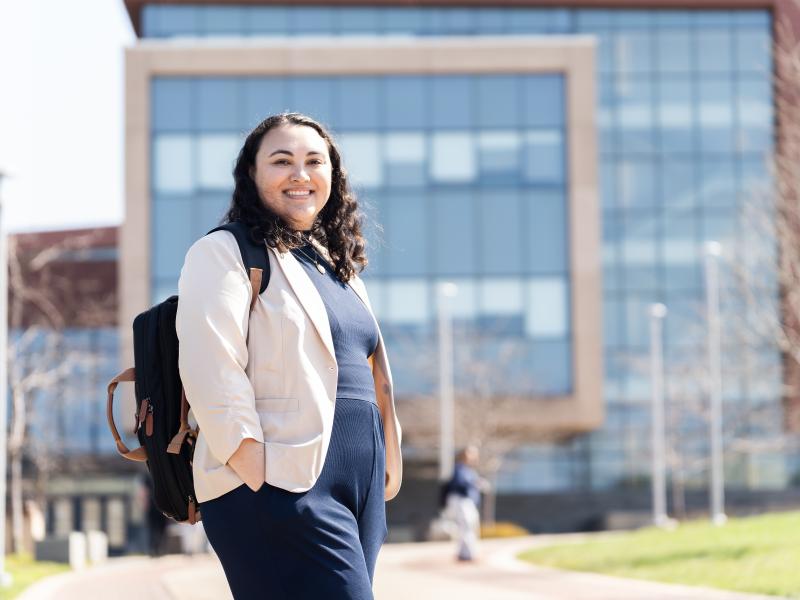 female student posing outside of the Shineman Center