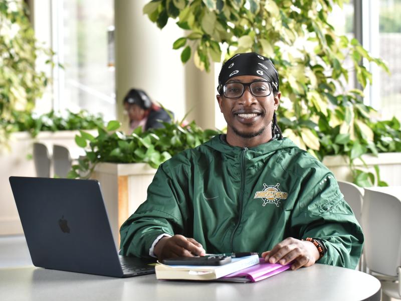 males student working on a computer