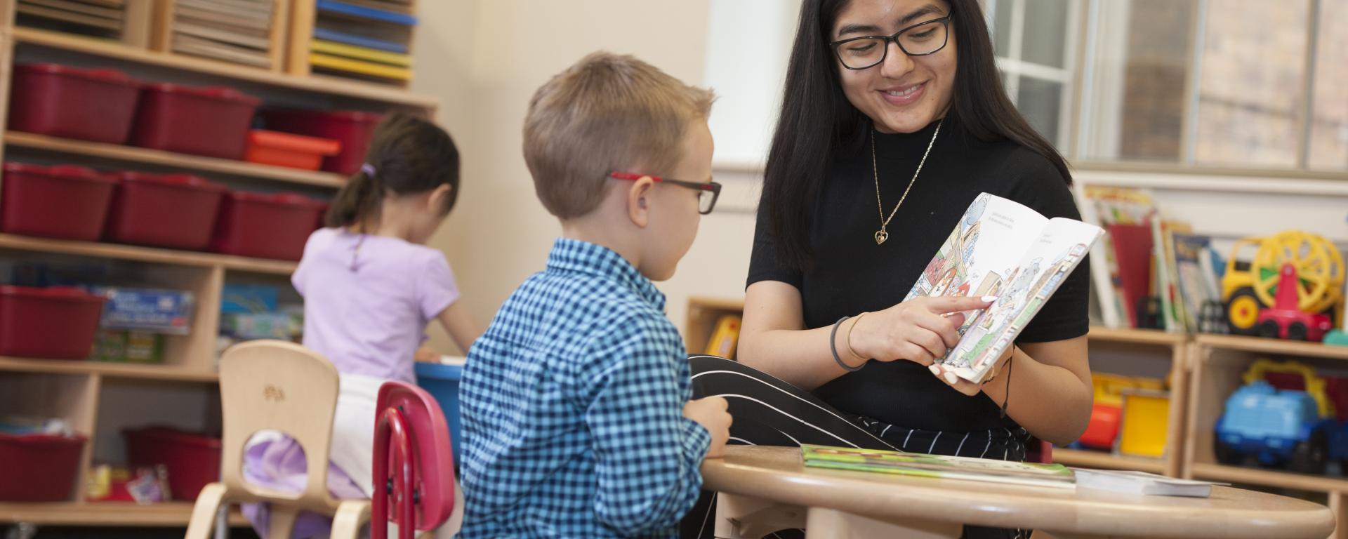 female student teacher working one on one with a student