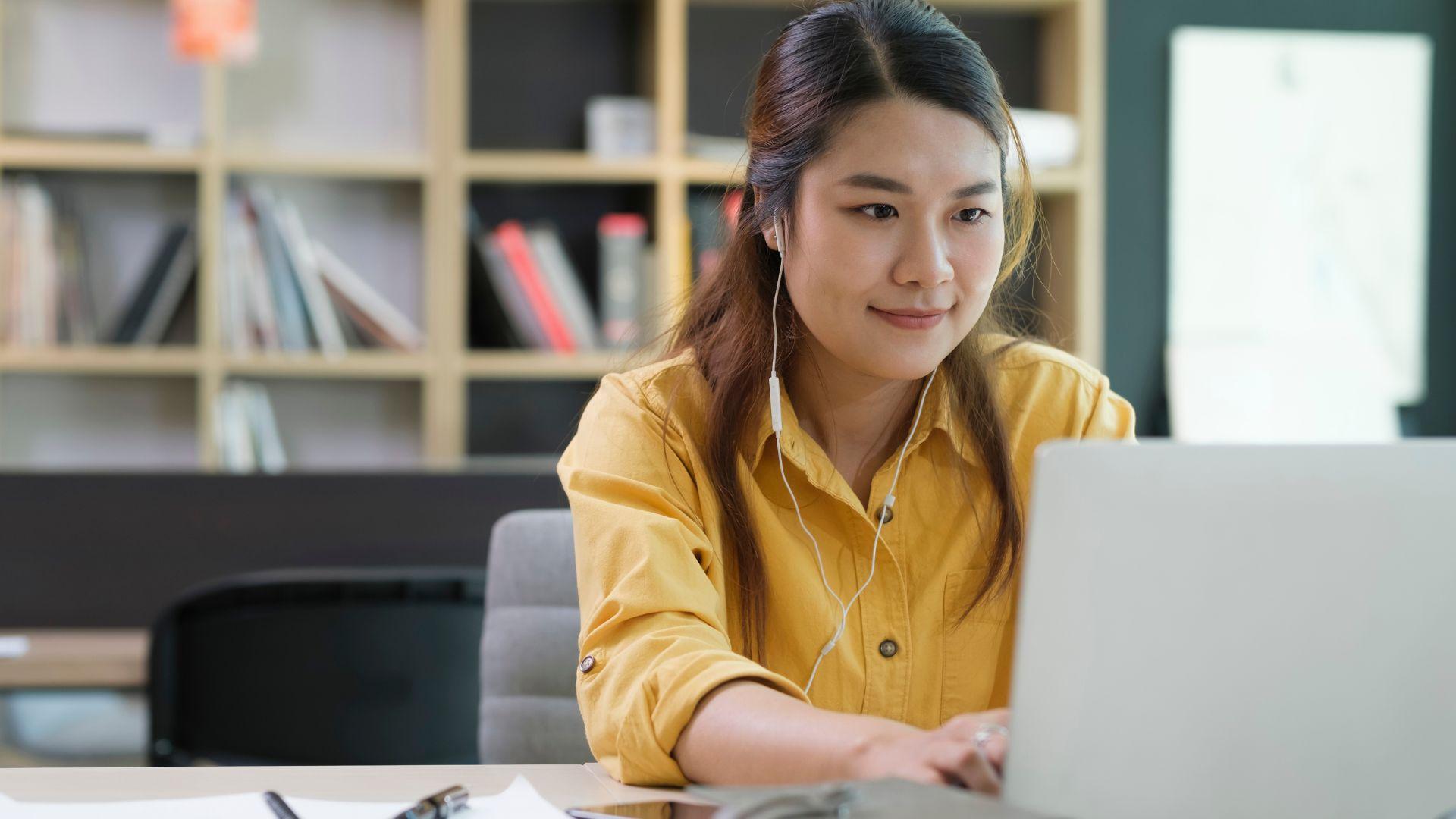 female student studying on a laptop