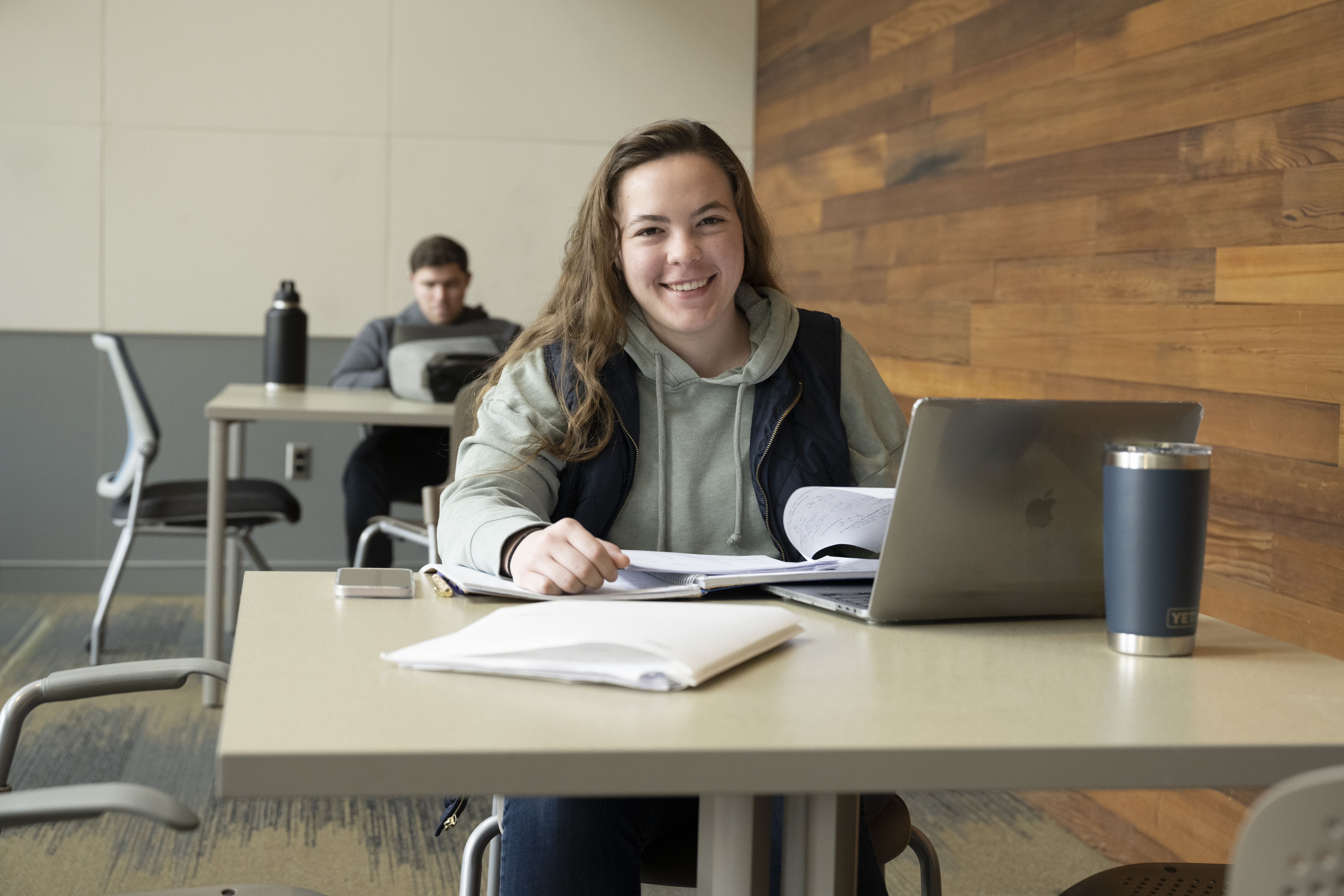 female student working on a laptop