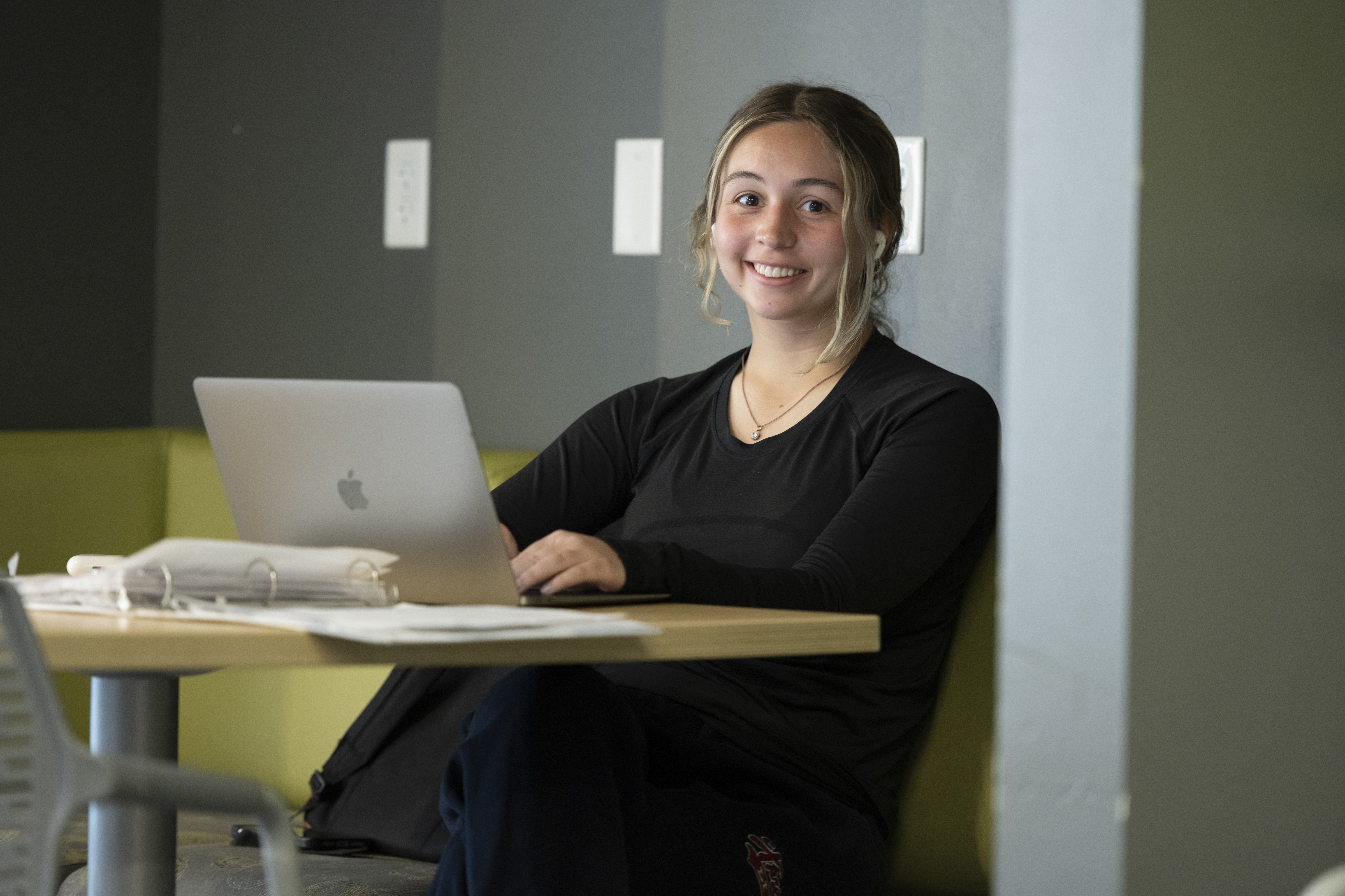 female student working on a laptop