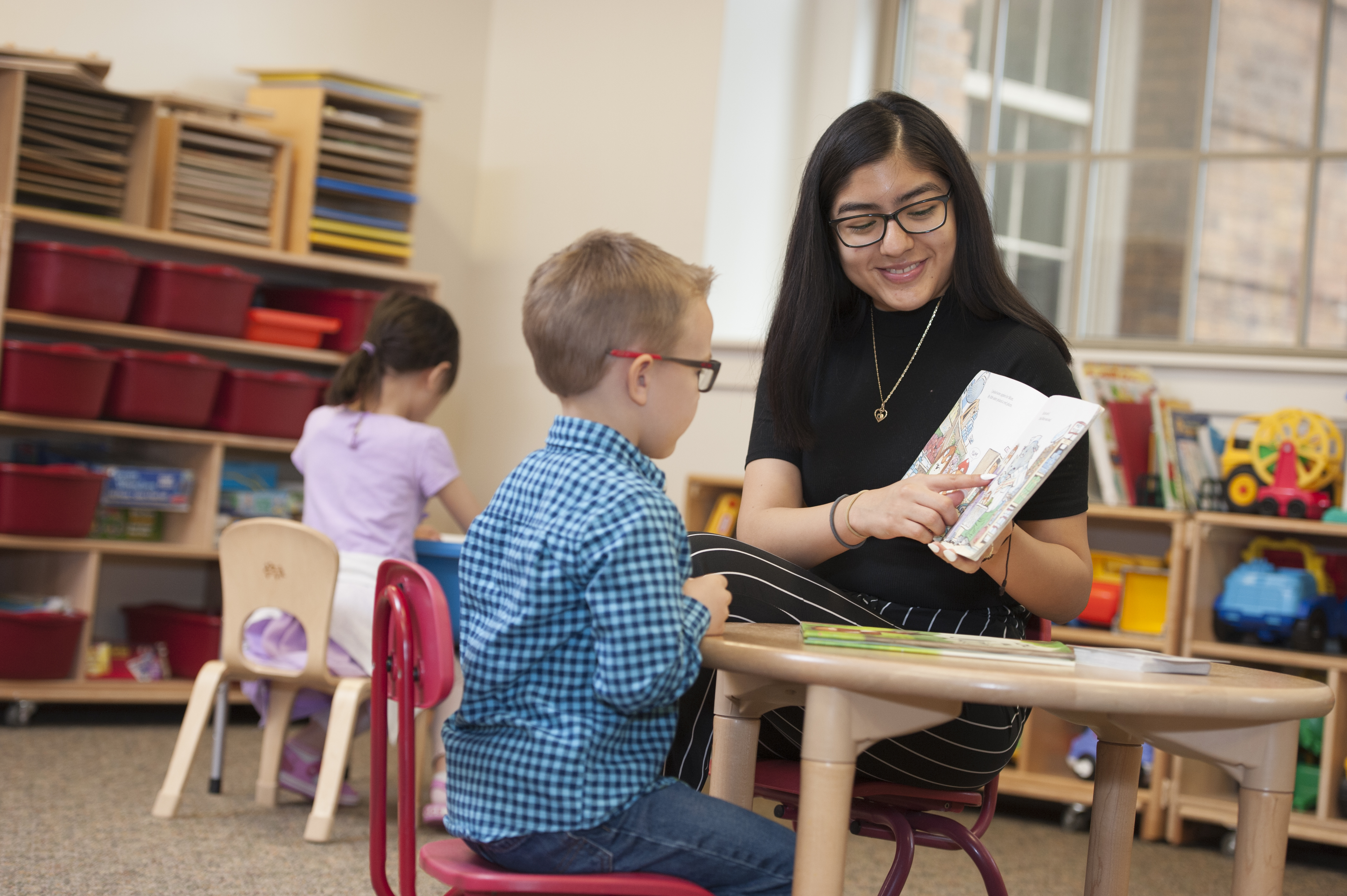 female student teacher working one on one with a student