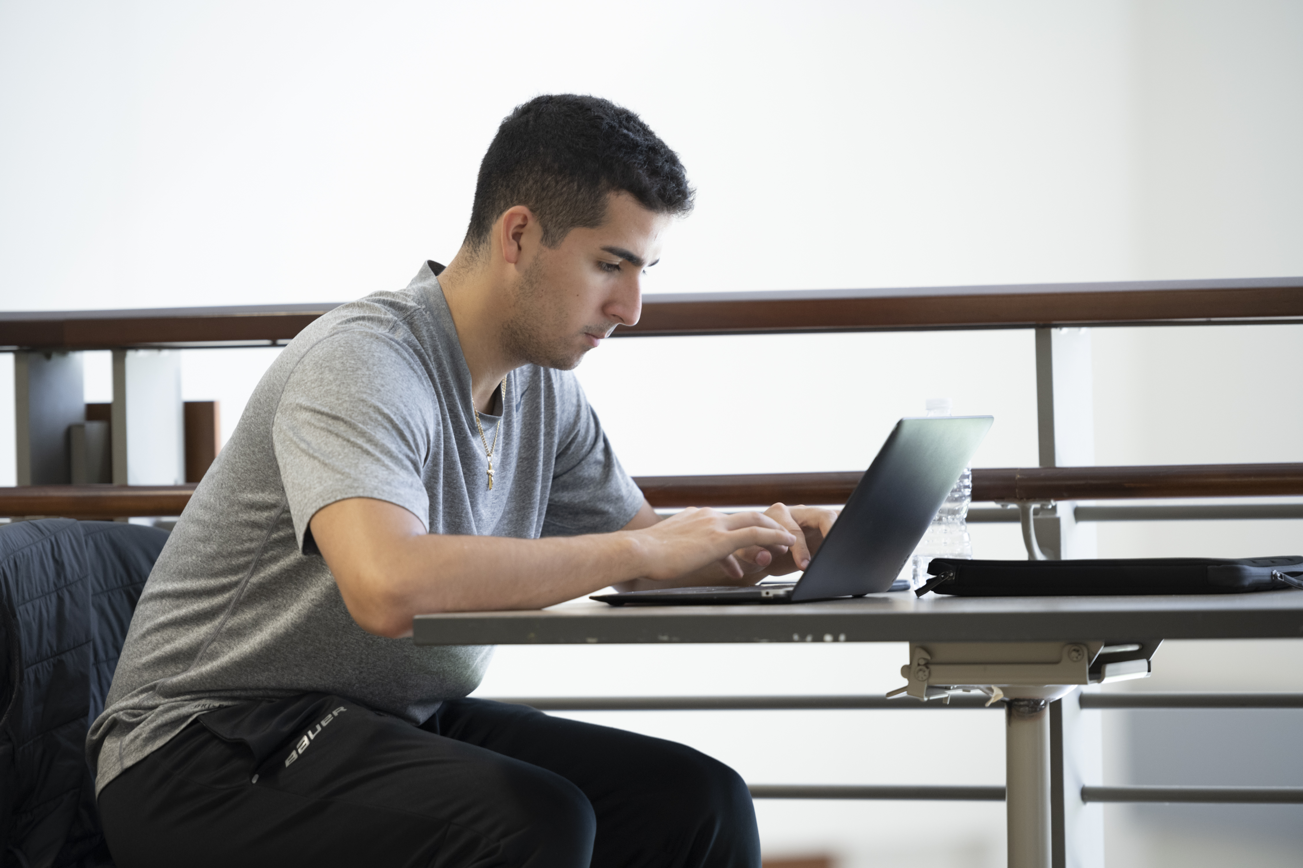 male student on laptop