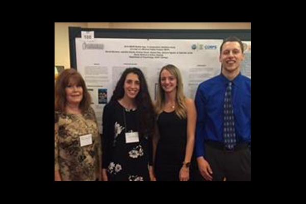 Karen Woolford at conference with students