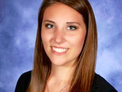 Psychology student Julianne Cary headshot on blue background