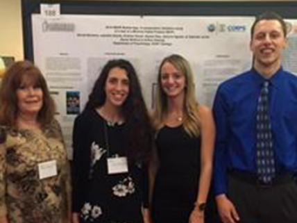 Karen Woolford at conference with students