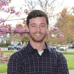 Psychology student, Peter Mancarella standing outside by tree