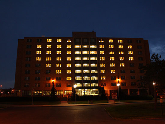 Night view of Hart Hall building with the lights of the rooms in the shape of a heart.
