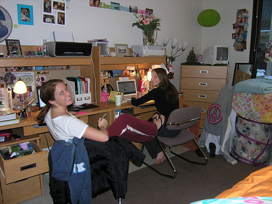 These female students have arranged their desks next to each other on one side of the room.