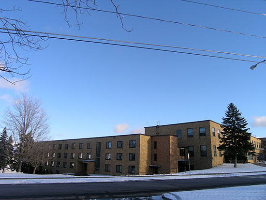 Winter scene of Lonis Hall, the northern part of Mackin Complex.