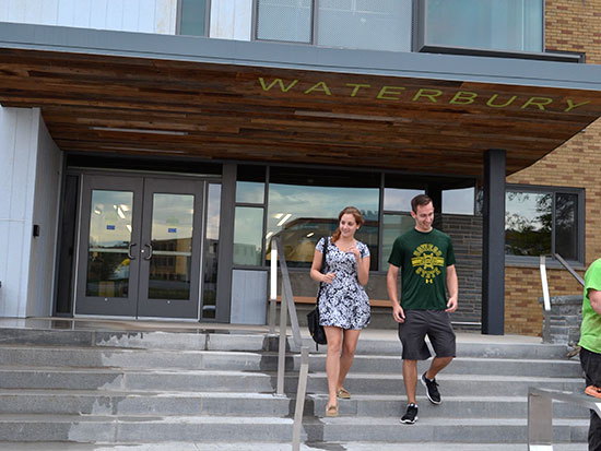 Students walking out of the newly remodeled Waterbury Hall.