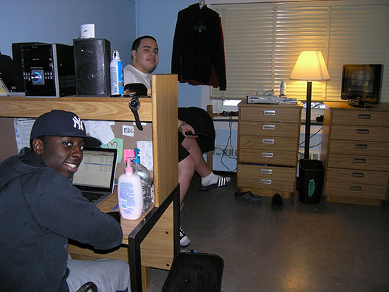 Two male roommates hanging out in their bedroom in Scales Hall.
