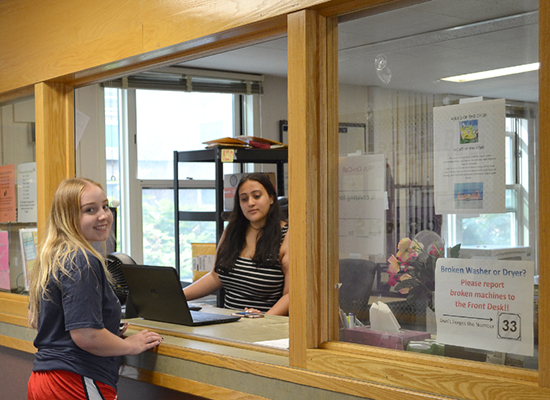 Student in Oneida Hall visits the Front Desk.