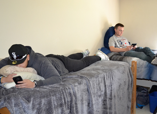 Riggs Hall residents lounge in their room between classes.