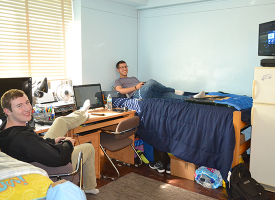 Moreland Hall (part of the Mackin Complex) residents hang out in their double room.