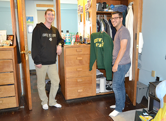 Moreland Hall (part of the Mackin Complex) residents in front of their closet/dresser unit.