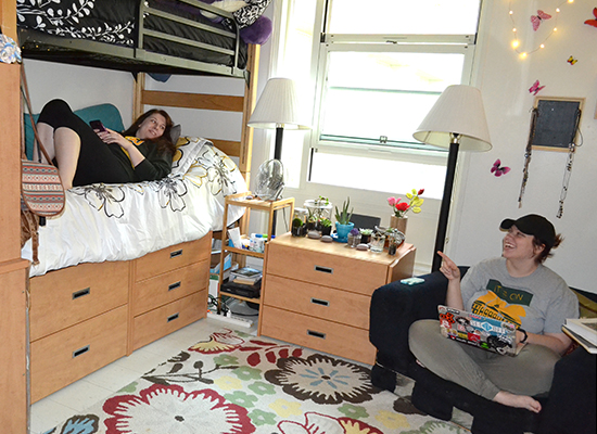 cayuga Hall room, female students hanging out.