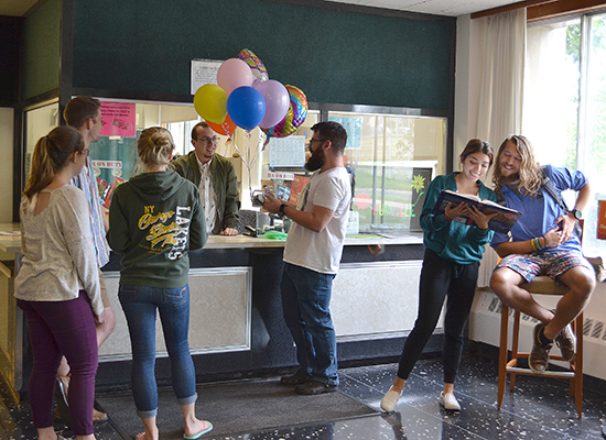 Funnelle Hall front desk with students.