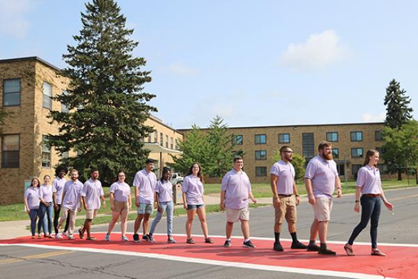 Mackin Complex (Moreland and Lonis Halls) and Sheldon Hall Resident Student Staff group photo. Re-enact the album cover of Abbey Road for fun.