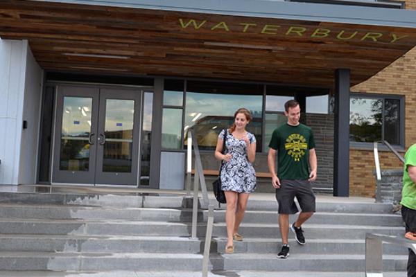 Students walking out of the newly remodeled Waterbury Hall.