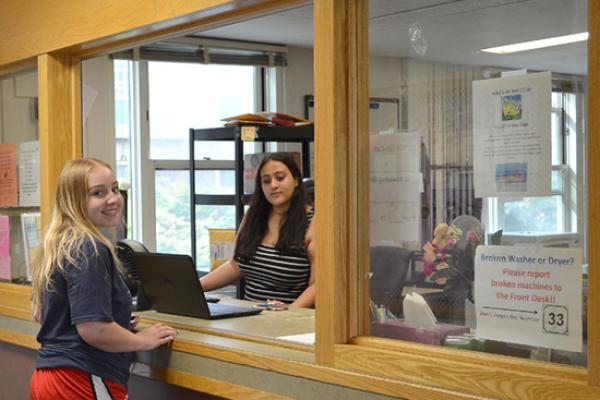 Student in Oneida Hall visits the Front Desk.