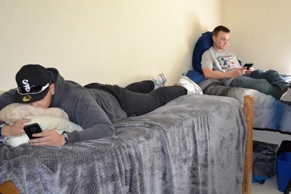 Riggs Hall residents lounge in their room between classes.