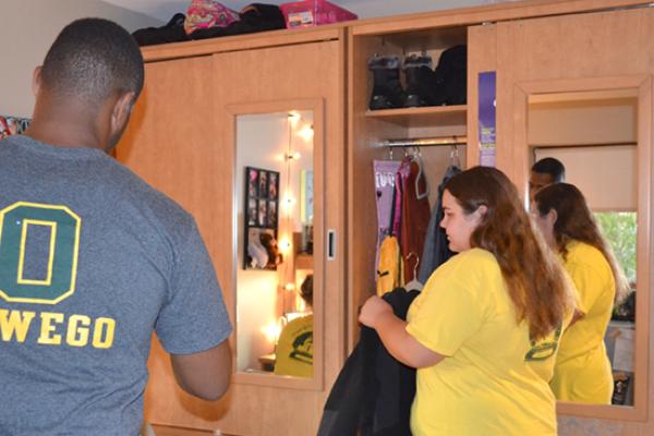 Residents of Johnson Hall are each assigned a large armoire with a mirror.