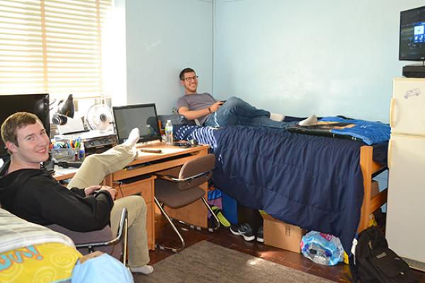 Moreland Hall (part of the Mackin Complex) residents hang out in their double room.