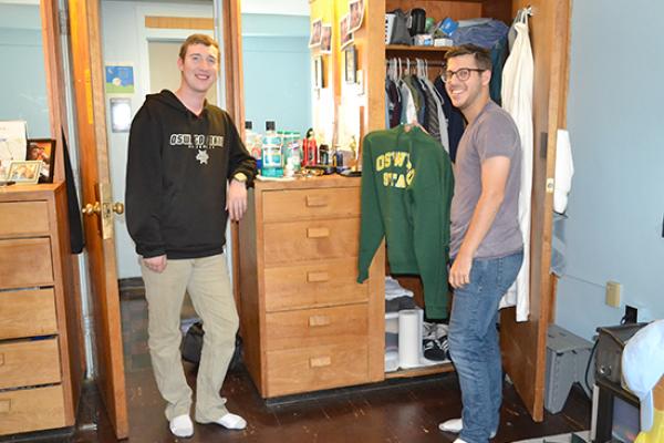 Moreland Hall (part of the Mackin Complex) residents in front of their closet/dresser unit.