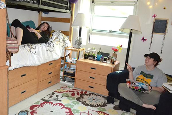 cayuga Hall room, female students hanging out.