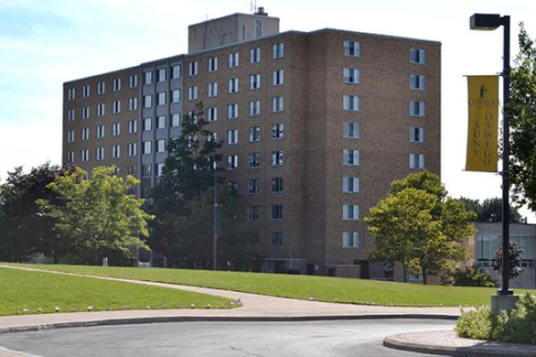 Funnelle Hall as seen from the campus center on 9/11. American flags line the sidewalk.