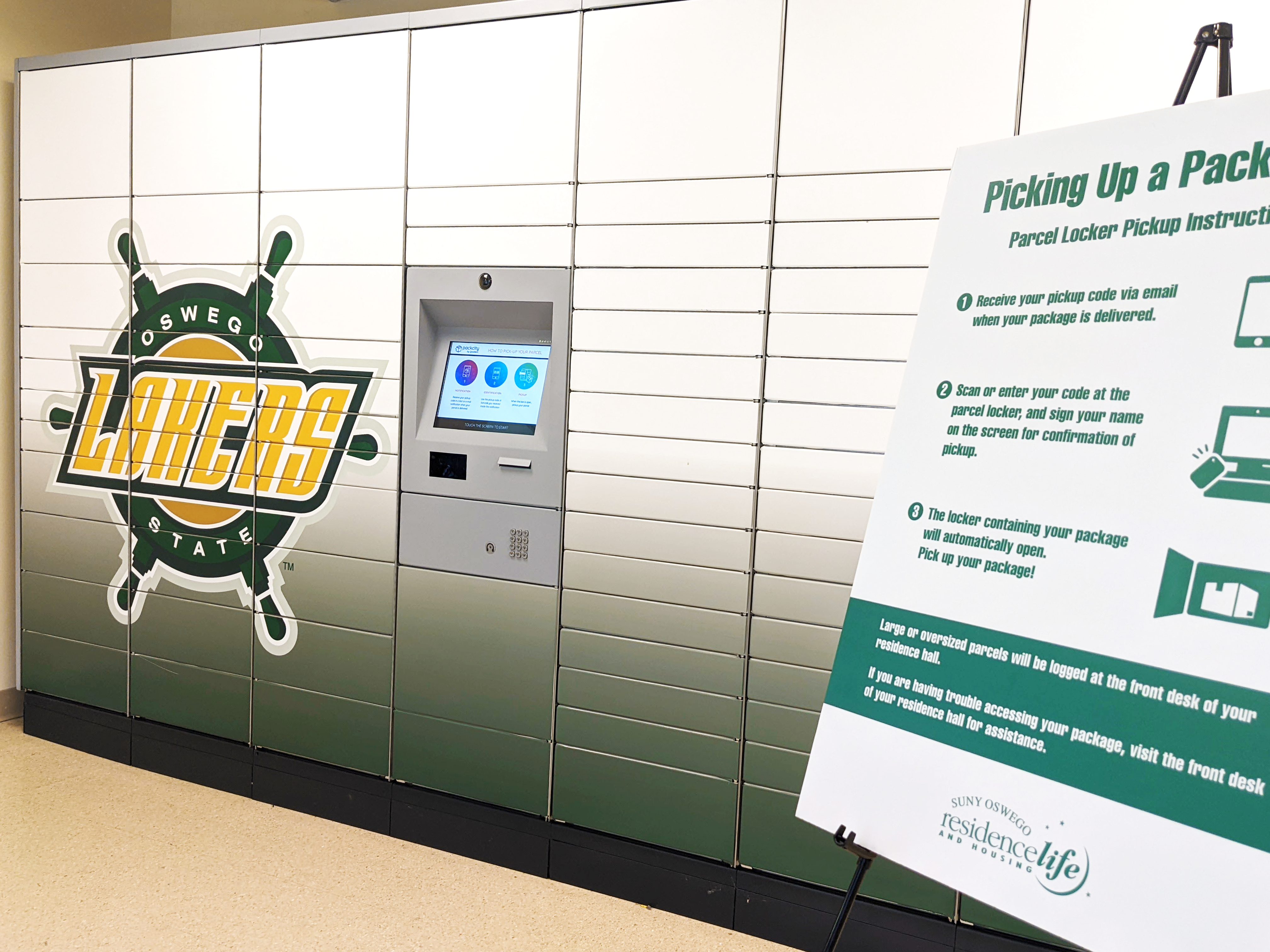 Parcel Lockers located in the basement of Lakeside Dining Center, along with a foam board detailing instructions for using the parcel lockers.