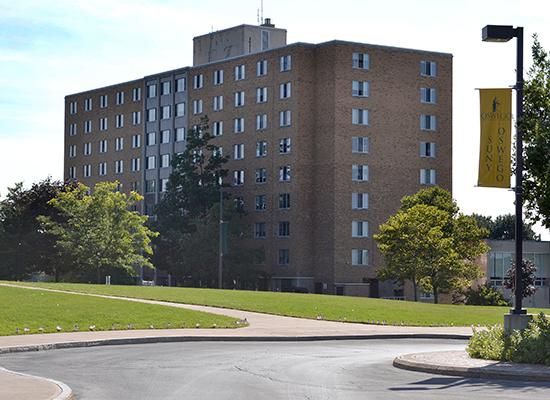 Funnelle Hall as seen from the campus center on 9/11. American flags line the sidewalk.