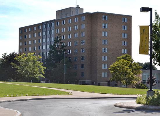 Funnelle Hall as seen from the campus center on 9/11. American flags line the sidewalk.