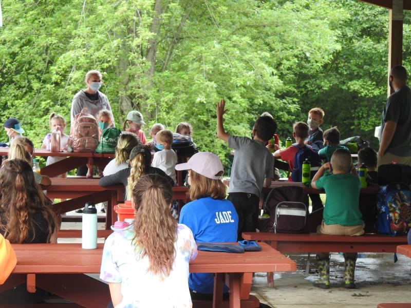 Children in an outdoor pavilion