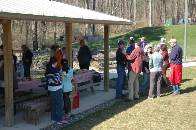 People gathered by the pavilion