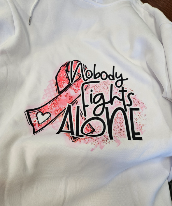 white sweatshirt with pink logo - ribbon and "nobody fights alone, SUNY Oswego"
