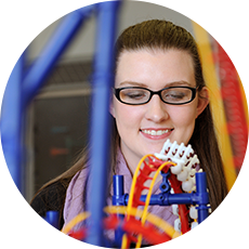 Student looking at physics project