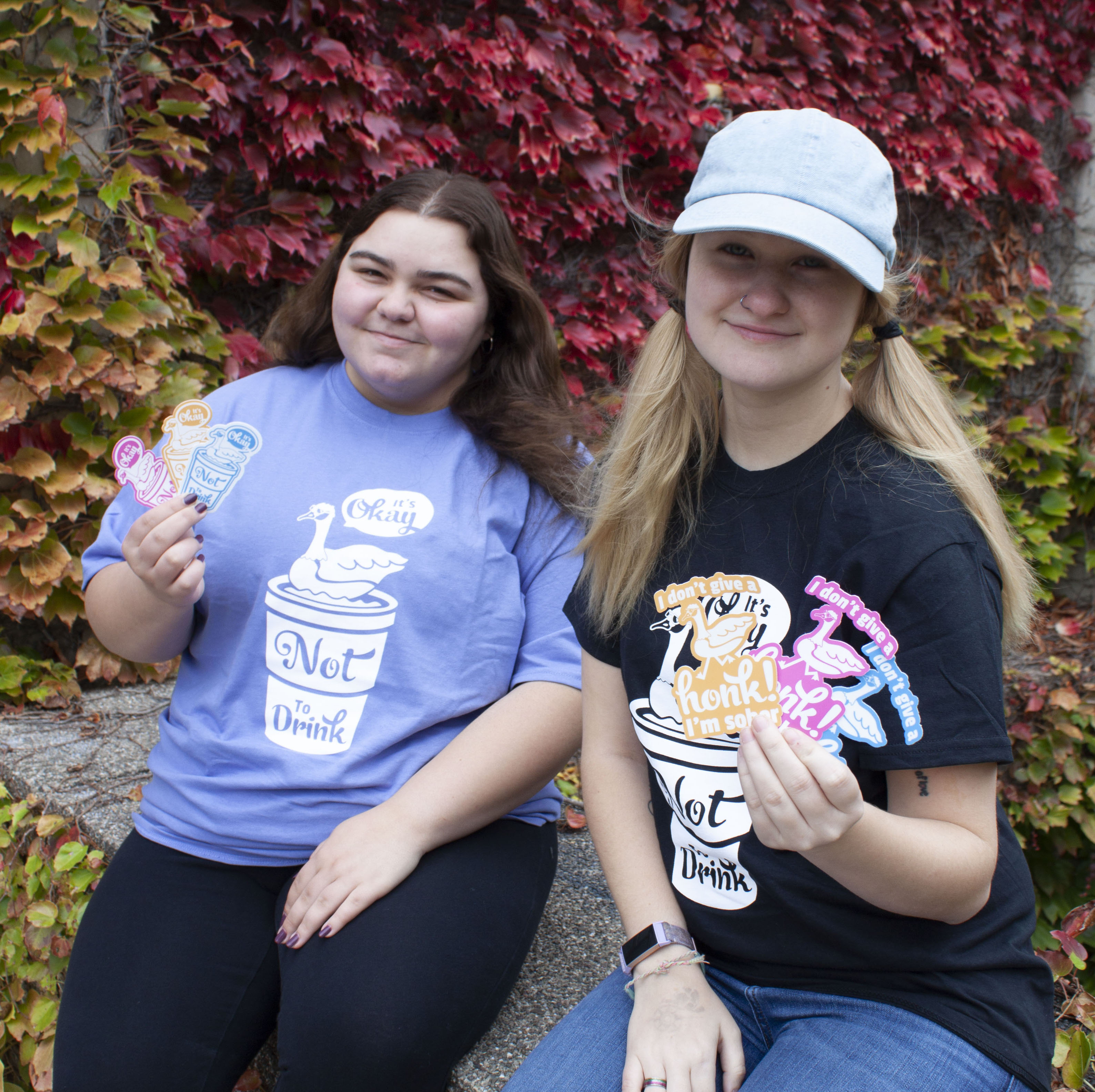 Students showing "It's Okay Not To Drink" merch