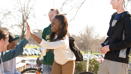 Students giving another student a high five